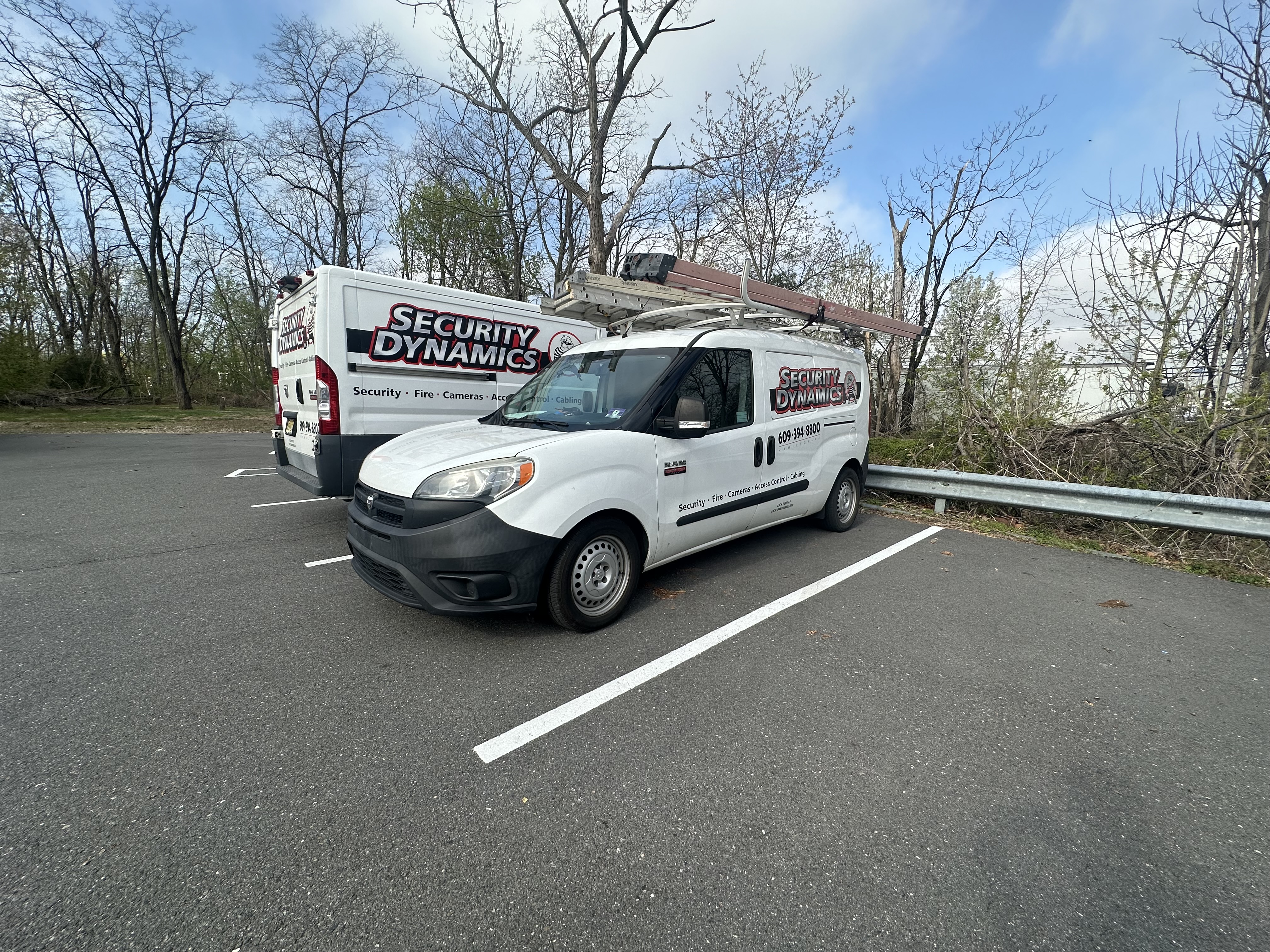 Security Dynamics fleet — two branded service vehicles ready for dispatch across NJ and PA